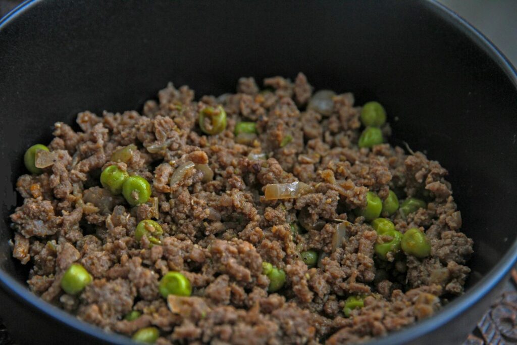 Ground Meat with Green Peas in a Bowl