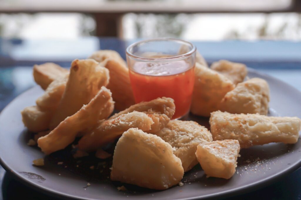 a plate of fried food with dipping sauce