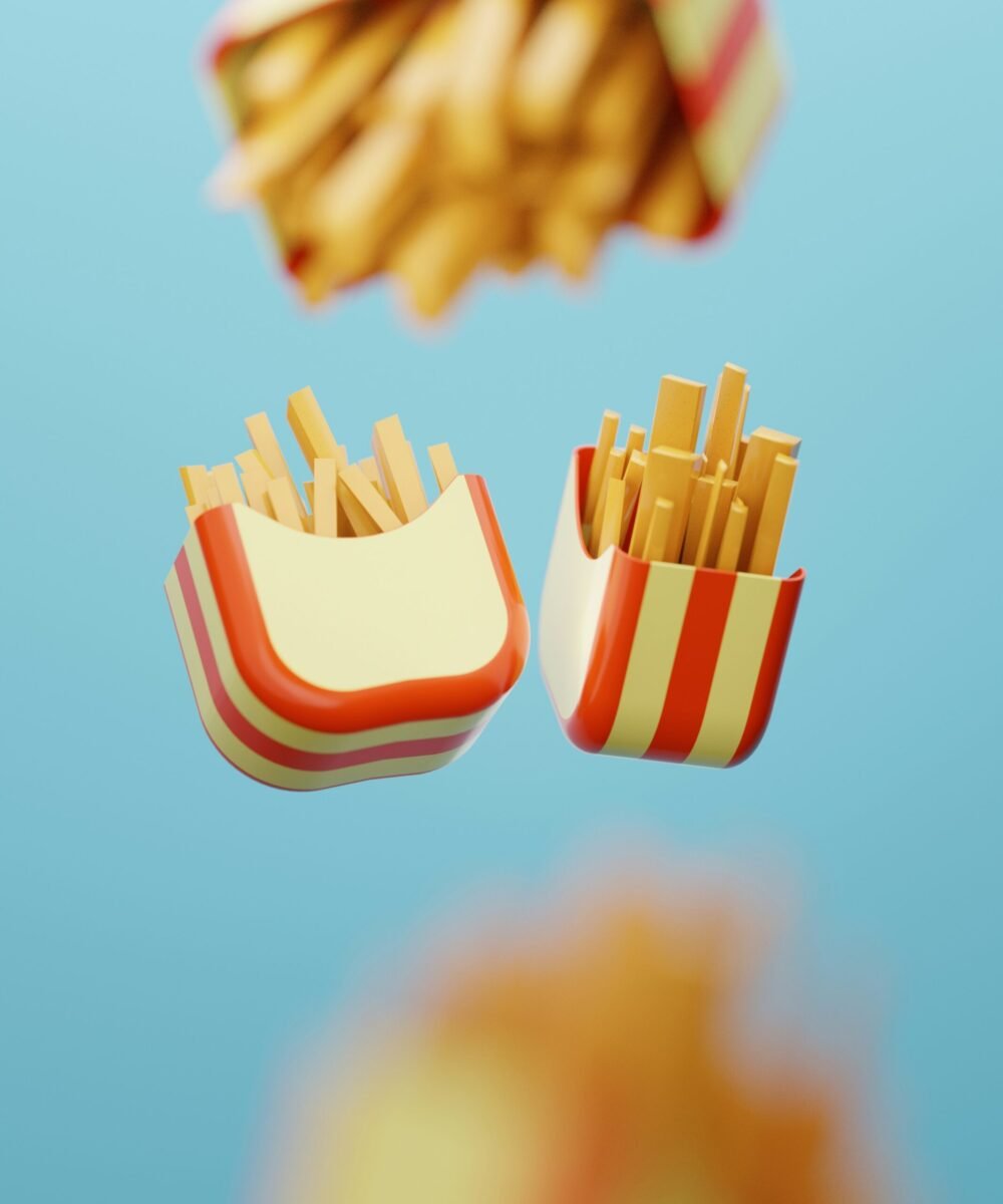 Bright, playful 3D renderings of french fry containers in red and yellow stripes floating against a blue background, showcasing fun and bold graphic design.